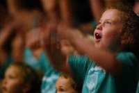 With arms flailing Taylor, 5, sings along with the audience to The Sunburned Sailor as the London Symphony Orchestra perfroms during the LSO Family Concert at Peabody, July 24, 2003. (Photo: Joanna Kaney Olivari)